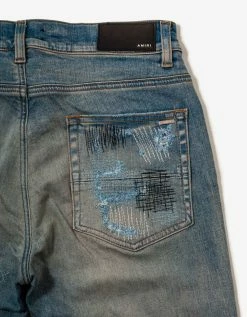 Amiri Clothing All Over Repair Clay Indigo Jeans