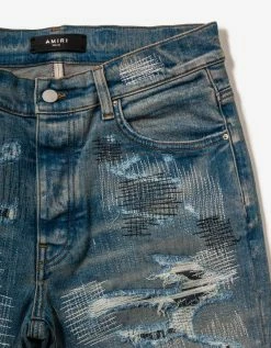 Amiri Clothing All Over Repair Clay Indigo Jeans