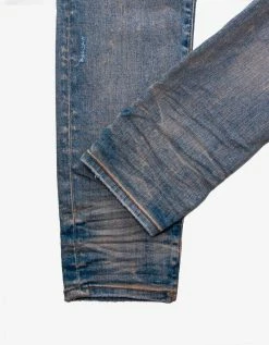 Amiri MX1 Clay Indigo Leather Insert Distressed Skinny Jeans