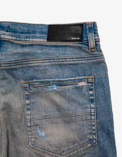 Amiri MX1 Clay Indigo Leather Insert Distressed Skinny Jeans