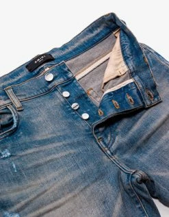 Amiri MX1 Clay Indigo Leather Insert Distressed Skinny Jeans