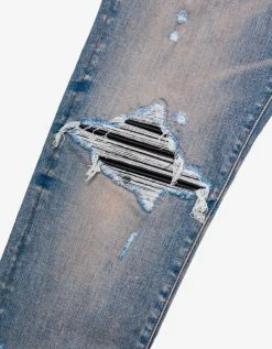 Amiri MX1 Clay Indigo Leather Insert Distressed Skinny Jeans